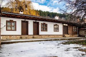 a house with snow in front of it at Фильовата къща in Zheravna