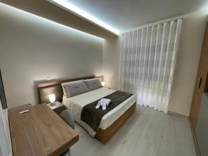 Een bed of bedden in een kamer bij Dimora Lucia