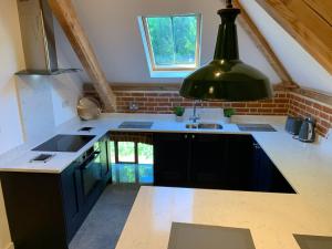 a kitchen with a sink and a counter top at Unique Countryside Retreat, walking distance to the Three Choirs Vineyard & Restaurant, Gloucestershire in Newent