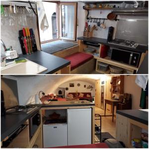 eine Küche mit schwarzen Arbeitsplatten und weißen Schränken in der Unterkunft Studio atypique rue de Turin (ancienne étable de village) in Breil-sur-Roya