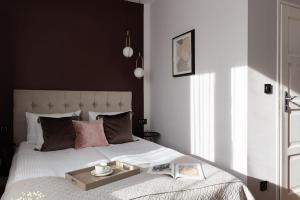 Postel nebo postele na pokoji v ubytování WILLA MAGNOLIA - Apartamenty i Pokoje - ROWERY, POKÓJ ZABAW, KAWA Z EKSPRESU