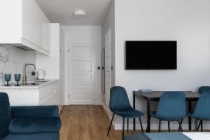 TV a/nebo společenská místnost v ubytování WILLA MAGNOLIA - Apartamenty i Pokoje - ROWERY, POKÓJ ZABAW, KAWA Z EKSPRESU