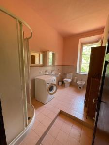 a bathroom with a shower, sink, and toilet at Villa di Corliano Relais all'Ussero in San Giuliano Terme
