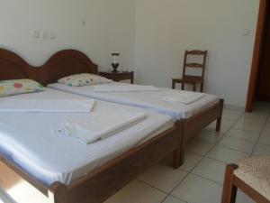 Postel nebo postele na pokoji v ubytování Discover Santorini