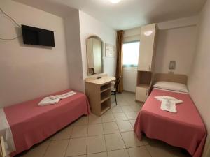 Posteľ alebo postele v izbe v ubytovaní Hotel Nanni Garnì