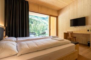 Campra Alpine Lodge & Spa 객실 침대