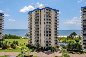 aominium building with the ocean in the background at Welcome To The Paradise in Fort Myers Beach