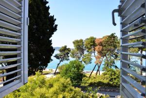 a view of the beach from a house at Apartment Nikki Kolovare Beach in Zadar