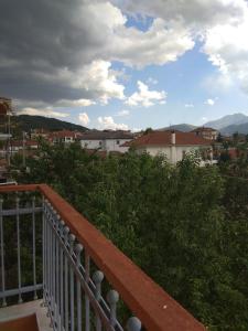 a balcony with a view of a city at Cozy house Ioannina neokesaria in Neokaisáreia