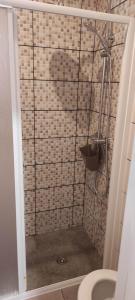 a shower stall with a toilet in a bathroom at Mar Rosa - Terraço Vista Praia in Horta +33 photos