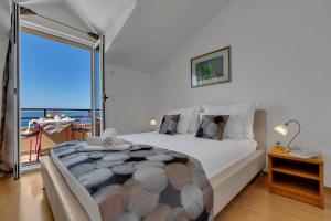 Postel nebo postele na pokoji v ubytování Apartments Danica Drašnice
