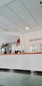 an office with a reception desk and a counter at Hotel Altaia in Altea