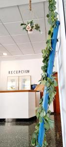 a plant on a pole in an office lobby at Hotel Altaia in Altea