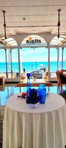 a table with two blue vases sitting on top of it at Hotel Altaia in Altea