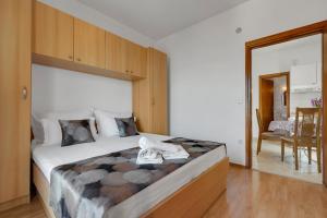 Postel nebo postele na pokoji v ubytování Apartments Danica Drašnice