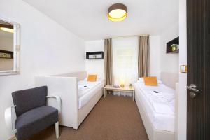 Posteľ alebo postele v izbe v ubytovaní Hotel Hradec