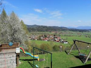 a park with a playground with a swing at Hölbinger Alm - Apartments in Anger