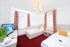 Posteľ alebo postele v izbe v ubytovaní Hotel Hradec