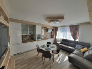 a living room with a couch and a table at Stella Maris in Kaštela