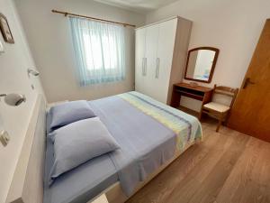 Postel nebo postele na pokoji v ubytování Apartments Villa Emilija