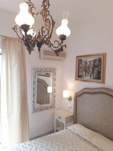 Cama ou camas em um quarto em Hotel La Perla