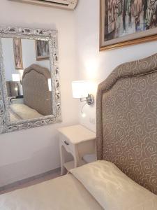 Cama ou camas em um quarto em Hotel La Perla