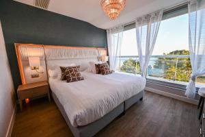 Le Diana Hôtel & Spa客房内的一张或多张床位