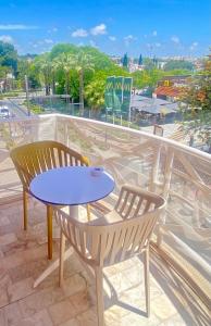 a table and two chairs on a balcony with a view at Vilamoura City Center Flat in Vilamoura