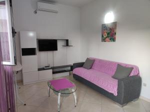 a living room with a couch and a table at Apartment Mativa in Makarska