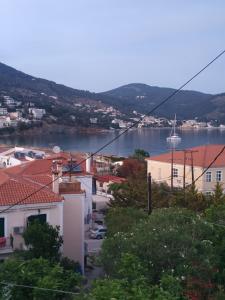 a view of a town with a body of water at Elthimia's apartment in Poros