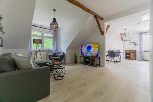 Μια τηλεόραση ή/και κέντρο ψυχαγωγίας στο Lausitz-Apartment, 80m2, Waschtrockner, 2 x Parkplätze, Küche, Netflix