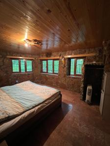 Giường trong phòng chung tại Qusar Forest