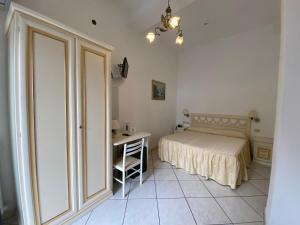 Cama ou camas em um quarto em Hotel La Perla
