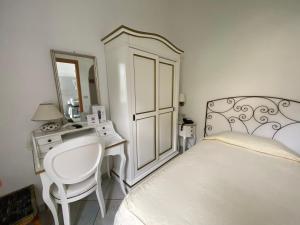 Cama ou camas em um quarto em Hotel La Perla