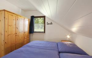Ein Bett oder Betten in einem Zimmer der Unterkunft Ferienhaus bei Zoe mit Sauna