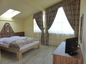 Posteľ alebo postele v izbe v ubytovaní Sástó Hotel