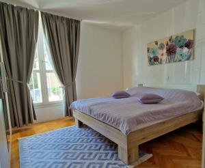 Posteľ alebo postele v izbe v ubytovaní Apartment DINA