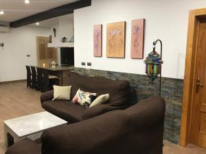 a living room with a couch and a table at La Belleza de Rodalquilar in Rodalquilar