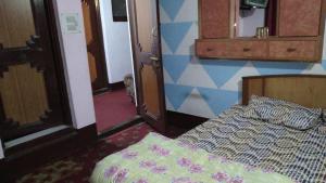 Postel nebo postele na pokoji v ubytování Al Amin Homestay