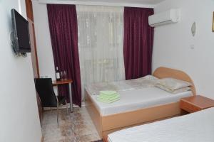 Voodi või voodid majutusasutuse Apartments Imper - IMD toas