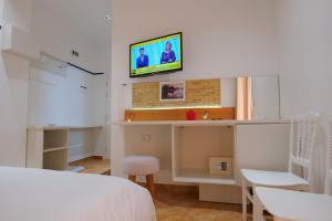 Postel nebo postele na pokoji v ubytování Hotel Piccolino