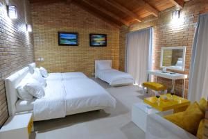 Postel nebo postele na pokoji v ubytování Hotel Piccolino