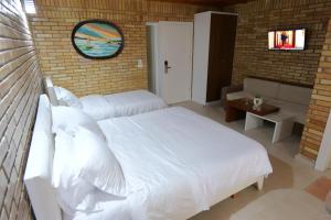 Postel nebo postele na pokoji v ubytování Hotel Piccolino