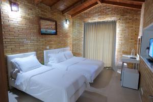 TV a/nebo společenská místnost v ubytování Hotel Piccolino