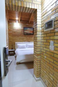 Postel nebo postele na pokoji v ubytování Hotel Piccolino