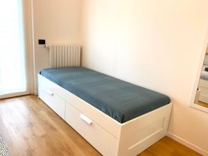 A bed or beds in a room at Appartamento Katia