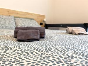 A bed or beds in a room at Appartamento Katia