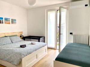 A bed or beds in a room at Appartamento Katia