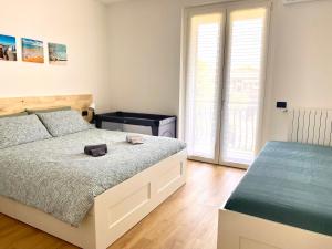 A bed or beds in a room at Appartamento Katia