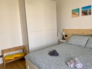 A bed or beds in a room at Appartamento Katia